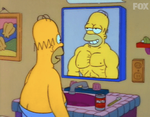 Omer Simpson devant un miroir qui fait jouer ses pectoraux